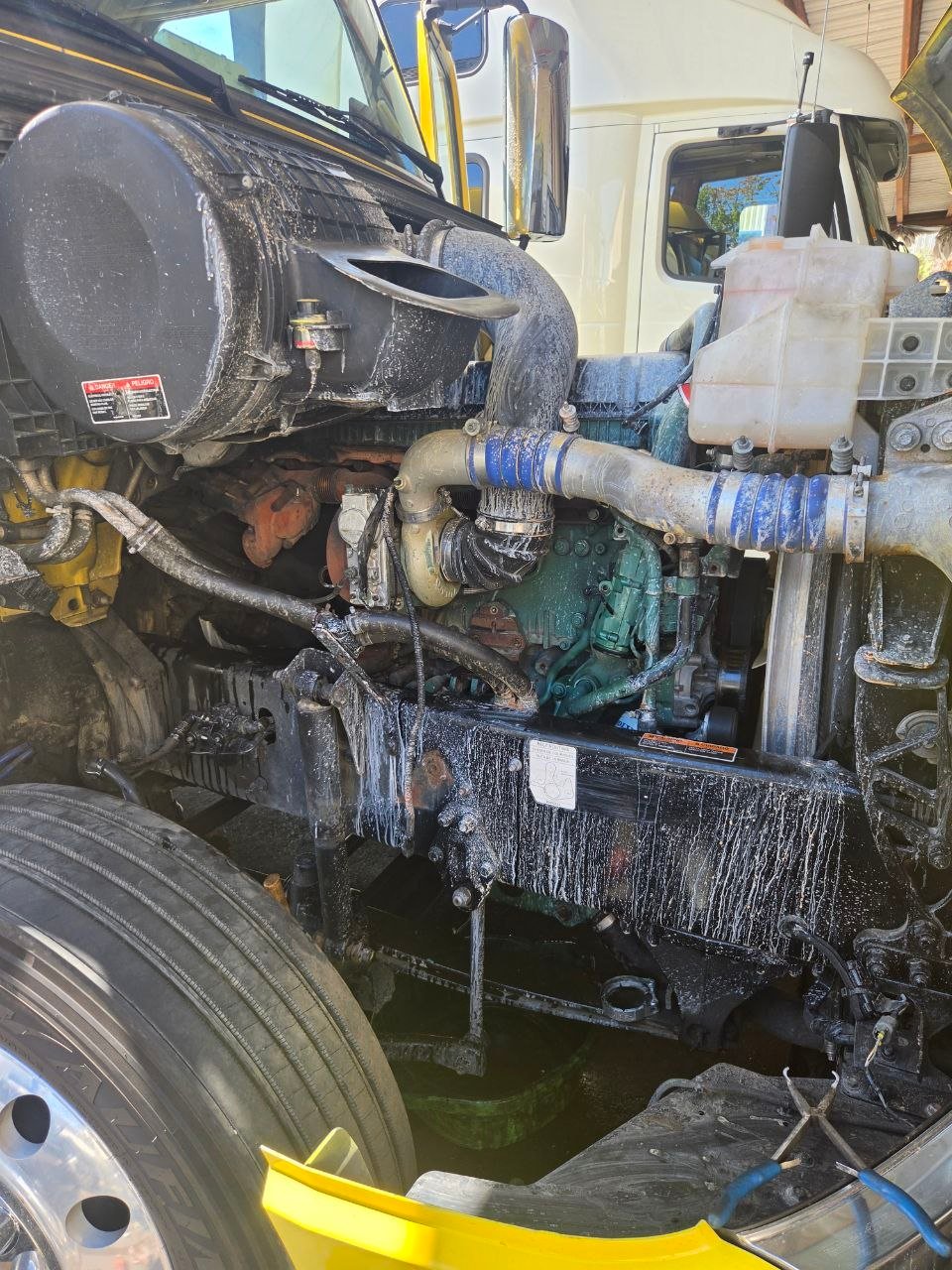 Volvo D13 EGR Cooler Failure: Why the Surge Tank Bubbled 1 Open hood and Volvo D13 engine bay during coolant-system diagnosis
