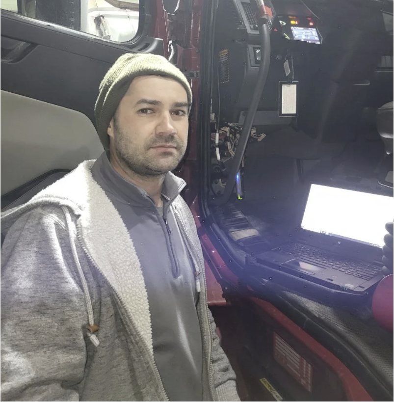Semi Truck Engine Fault Codes Explained: SPN, FMI and the Codes Drivers See Most 1 Truck Pit Stop mechanic with a diagnostic laptop plugged into a semi truck to read SPN and FMI fault codes in Matthews, North Carolina
