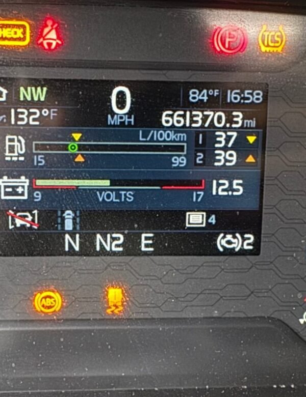 Semi truck dash showing check engine, ABS and traction lamps lit before a code scan at Truck Pit Stop in Matthews, North Carolina