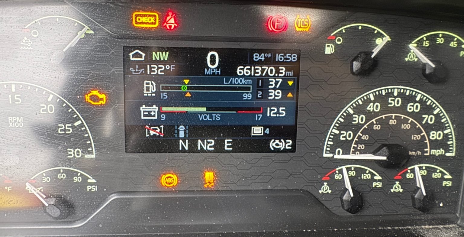 Semi truck dash showing check engine, ABS and traction lamps lit before a code scan at Truck Pit Stop in Matthews, North Carolina