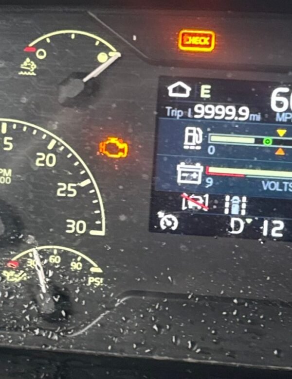 Semi truck dash at 60 mph with the check engine lamp on, the kind of fault that leads to an SCR inducement derate